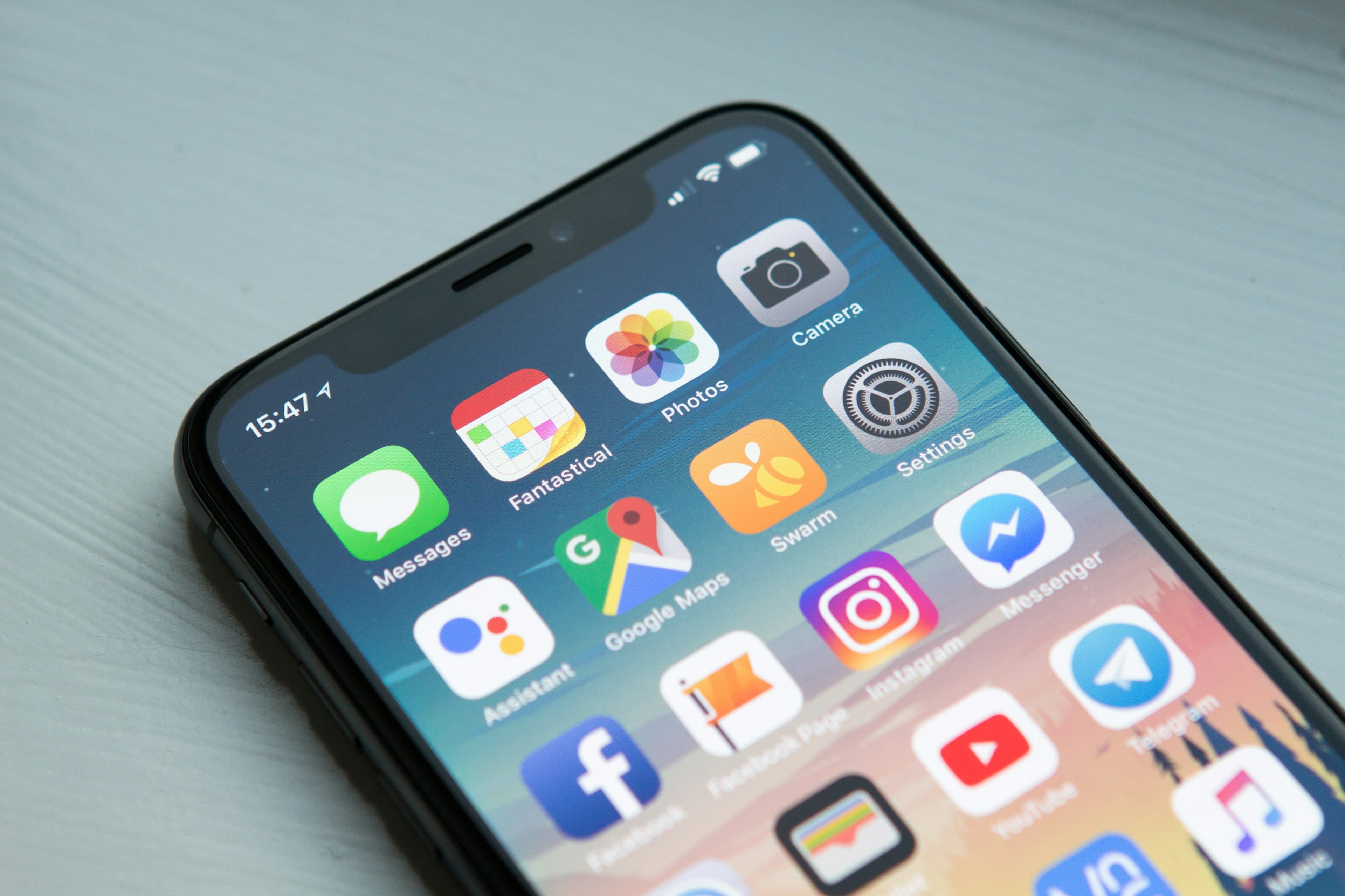 Close-up of a smartphone home screen filled with mobile apps